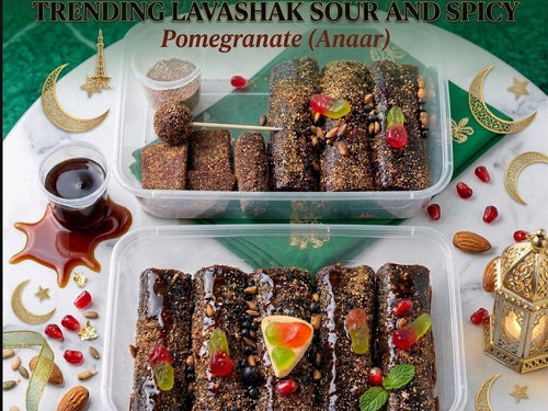 Lavashak trays presented on a green Eid themed setting with imli sauce, almonds and anaar seeds