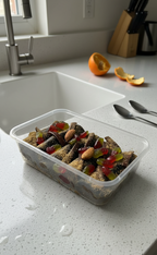 Chilli Milli lavashak rolls topped with almonds and gummies on a kitchen counter